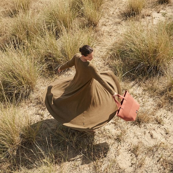 AI photoshoot: woman in hot pink KALK beanie and checkered scarf winter portrait