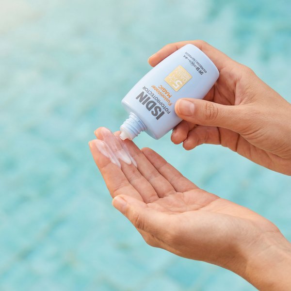 AI product photography: ISDIN sunscreen dispensing over turquoise pool water