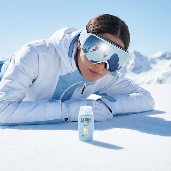 ISDIN sunscreen with model in ski setting, demonstrating AI-generated seasonal ad creative variation